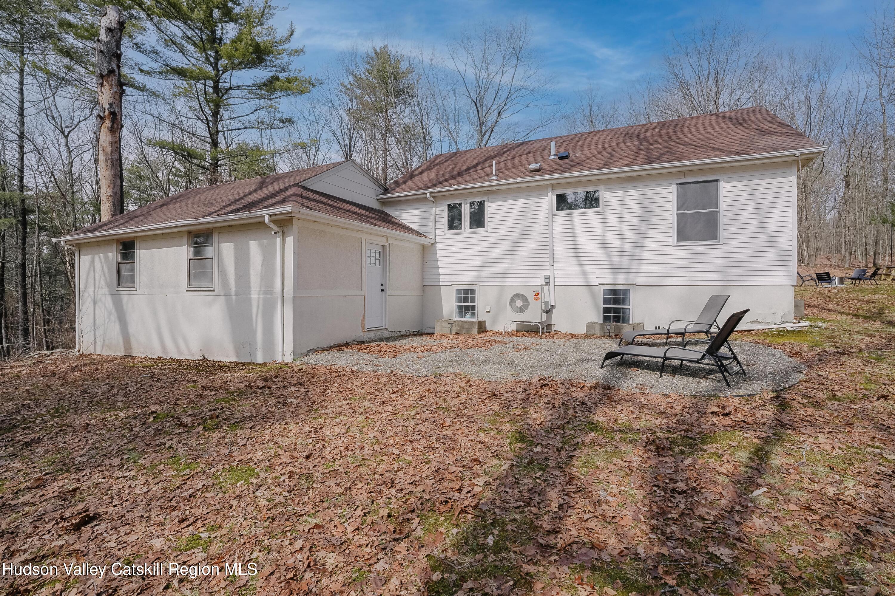230 Potic Mountain Road Athens, NY 12414 - Photo 2 of 25 a white house covered with tall trees
