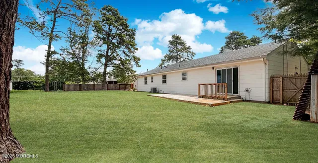 a view of a backyard with a sitting area