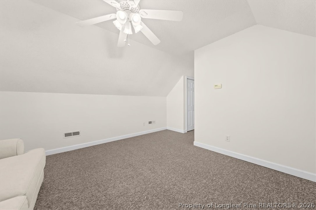 60 Spring Lake Drive Pinehurst, NC 28374 - Photo 31 of 42 an empty room with a ceiling fan and a window