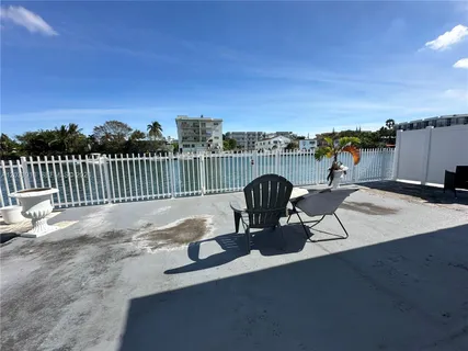 a view of a chairs and table on the terrace