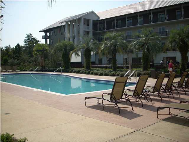 2108 Highway 30a Santa Rosa Beach, Unit 312 Santa Rosa Beach, FL 32459 - Photo 2 of 9 a view of swimming pool with outdoor seating and plants