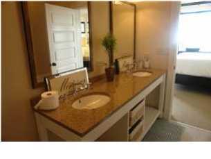 2108 Highway 30a Santa Rosa Beach, Unit 312 Santa Rosa Beach, FL 32459 - Photo 8 of 9 a bathroom with a sink double vanity and a mirror