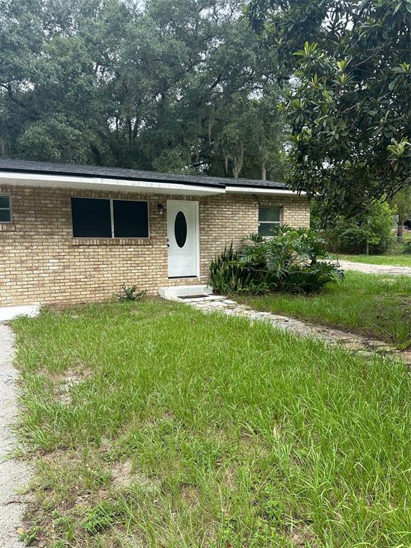34825 Cutoff Road, Unit B Fruitland Park, FL 34731 - Photo 1 of 9 a house view with a backyard space