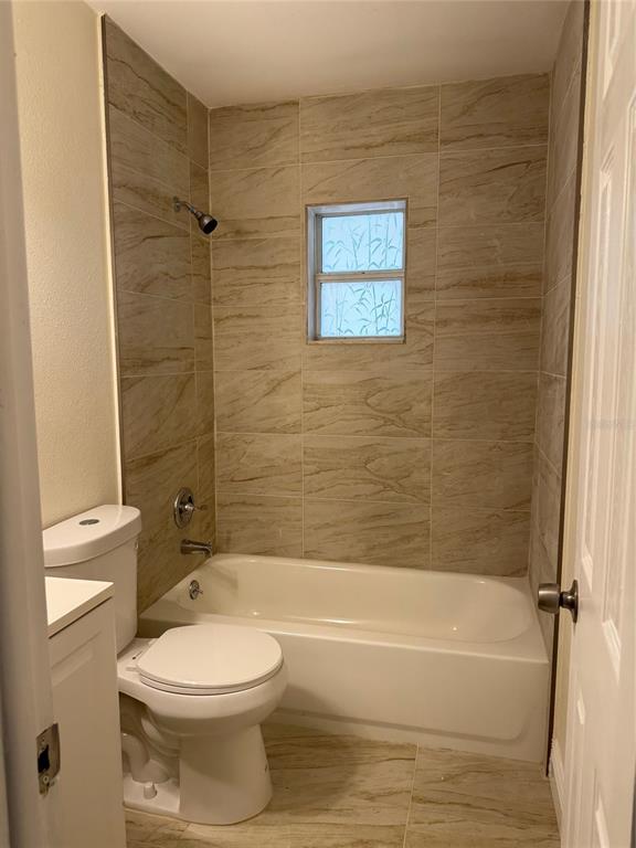 34825 Cutoff Road, Unit B Fruitland Park, FL 34731 - Photo 9 of 9 a bathroom with a toilet and a bath tub