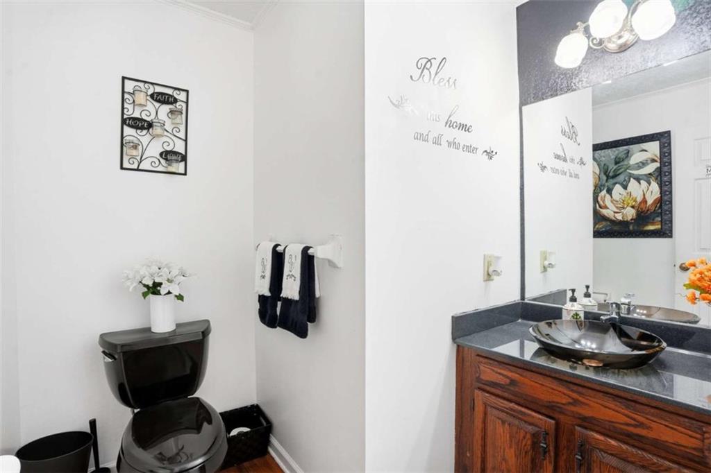 3811 Brookvale Place Decatur, GA 30034 - Photo 15 of 40 a bathroom with a granite countertop sink and a mirror