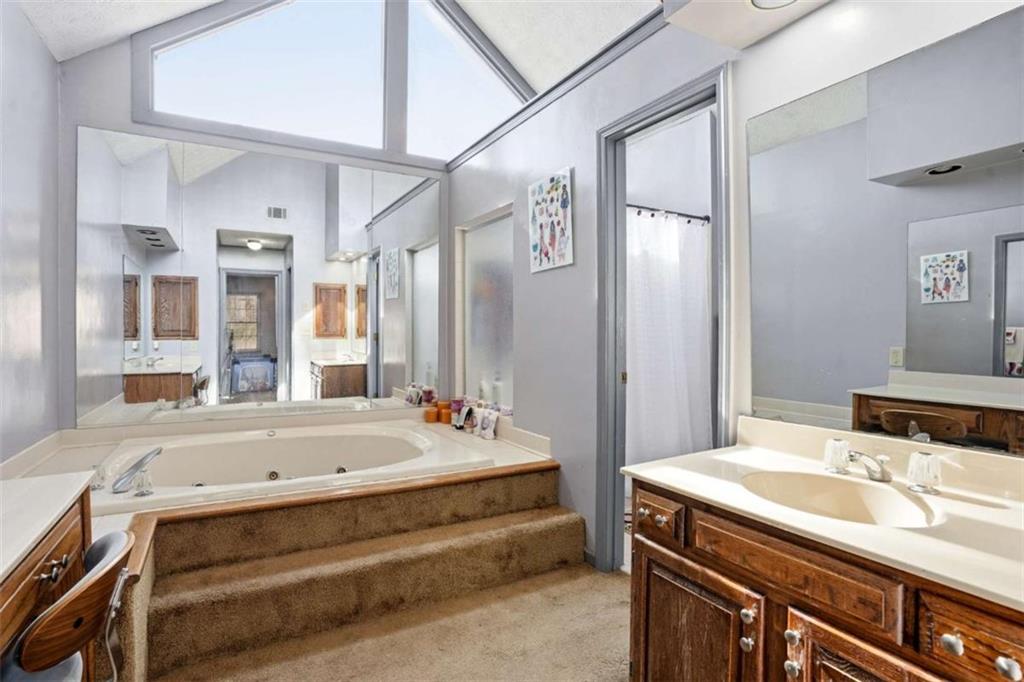 3811 Brookvale Place Decatur, GA 30034 - Photo 22 of 40 a bathroom with a tub sink and mirror