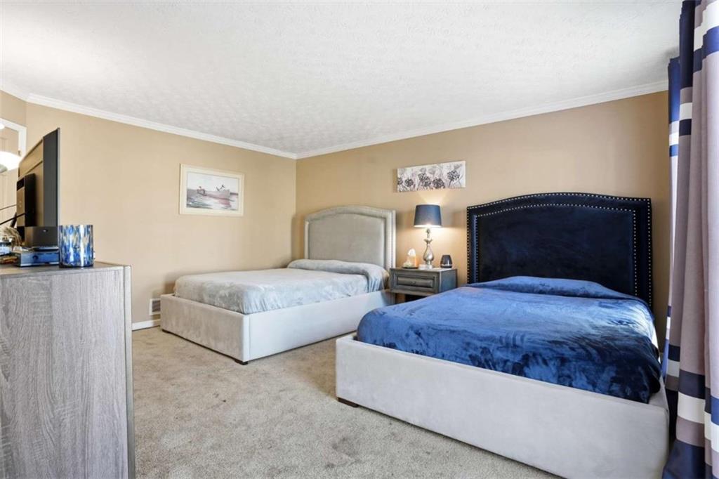 3811 Brookvale Place Decatur, GA 30034 - Photo 24 of 40 a bedroom with a bed and a couch