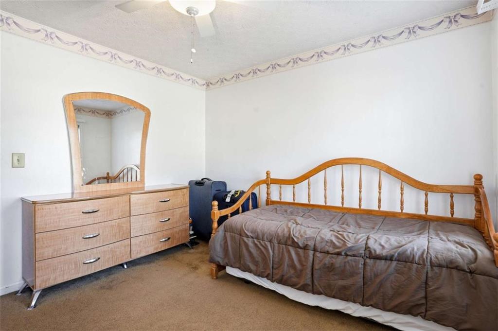 3811 Brookvale Place Decatur, GA 30034 - Photo 28 of 40 a bedroom with a bed and a mirror on the dresser