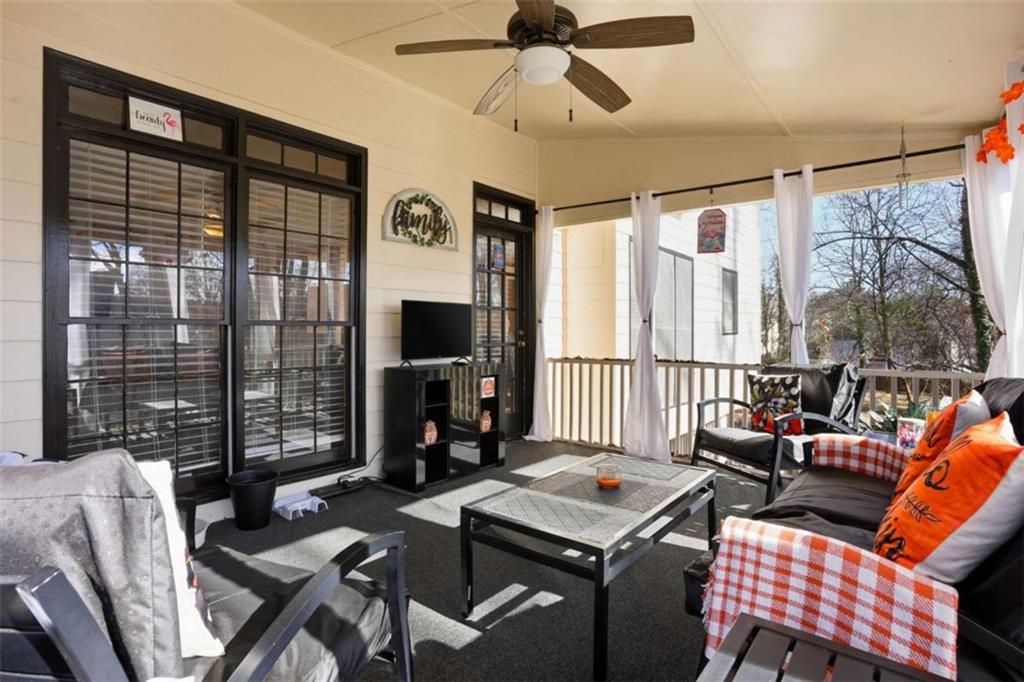 3811 Brookvale Place Decatur, GA 30034 - Photo 37 of 40 a living room with furniture a flat screen tv and a large window