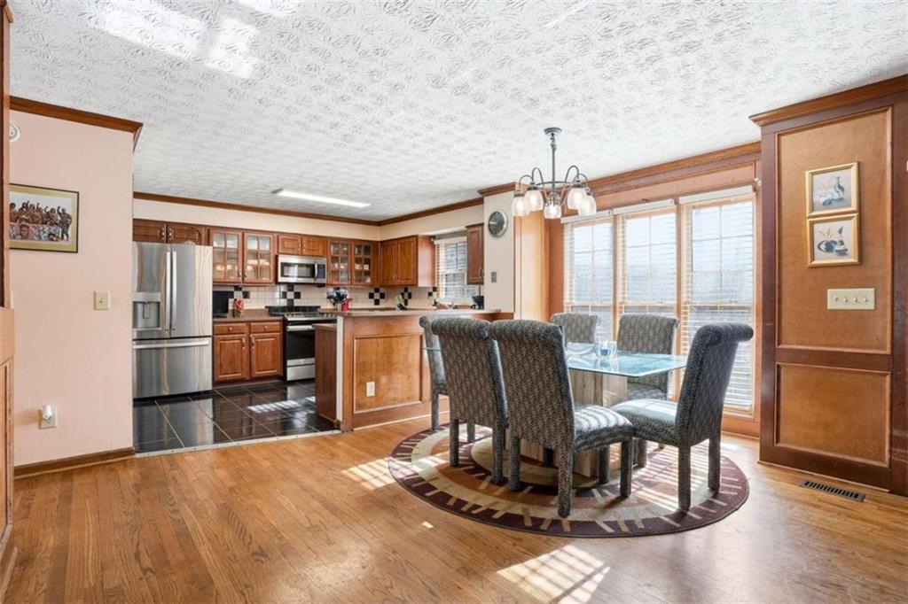 3811 Brookvale Place Decatur, GA 30034 - Photo 9 of 40 a view of a dining room with furniture window and wooden floor
