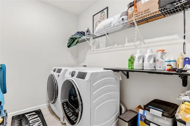 a utility room with dryer and washer