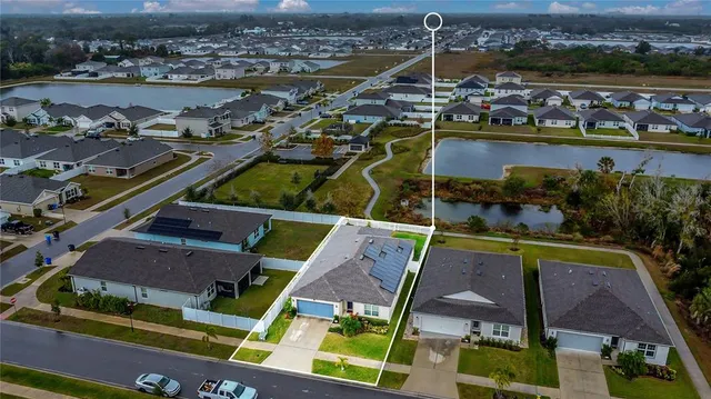 an aerial view of houses with outdoor space