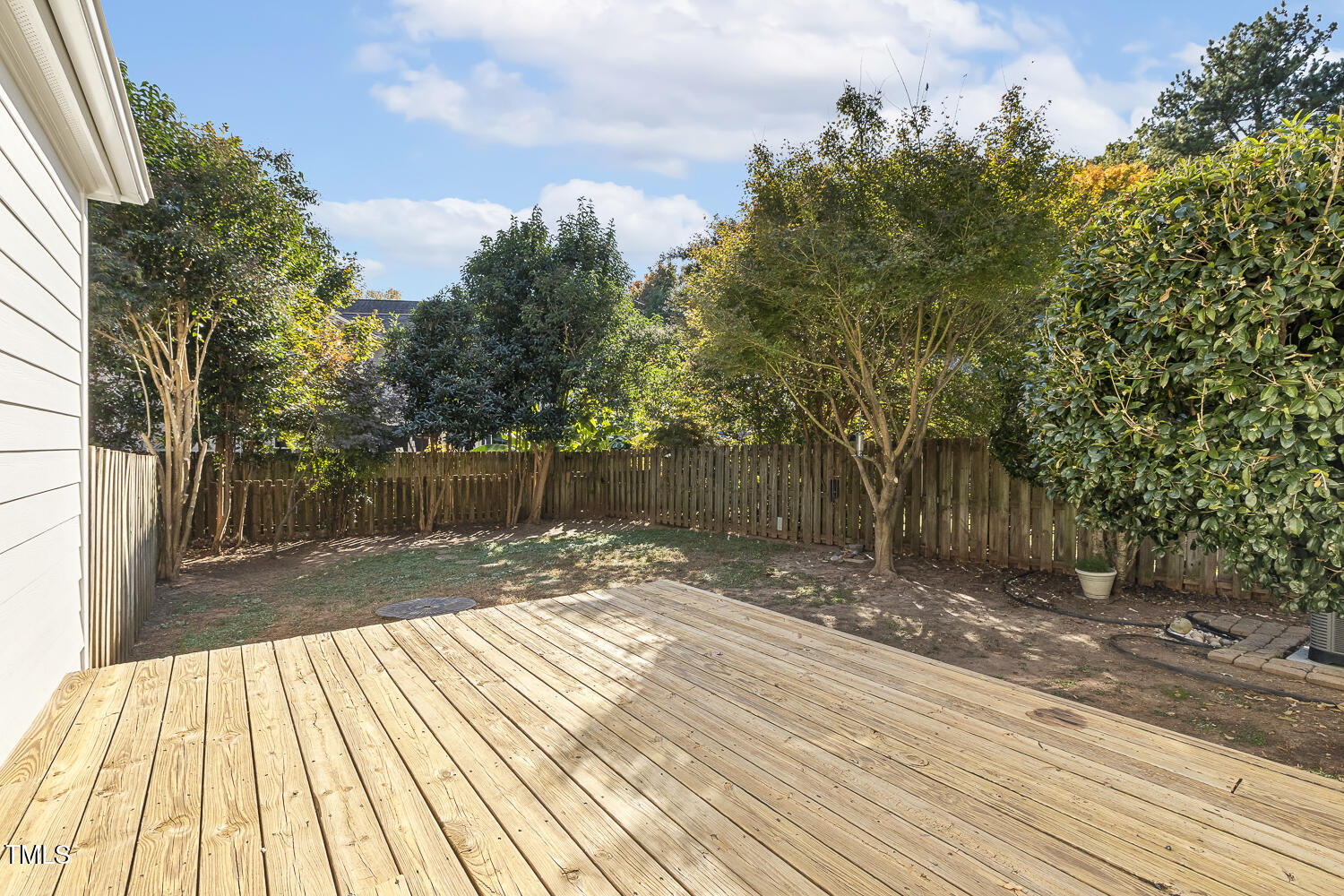 616 East Whitaker Mill Road Raleigh, NC 27608 - Photo 12 of 13 a view of backyard with wooden floor and fence