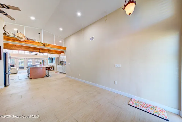 a living room with furniture and painting on the wall