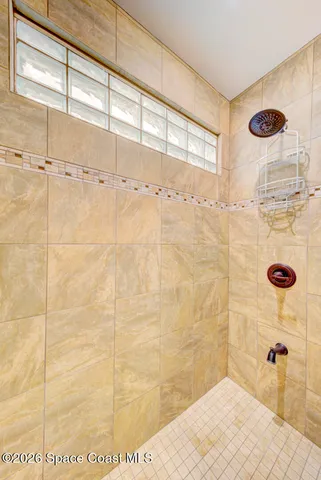 a view of a house with swimming pool and sitting area