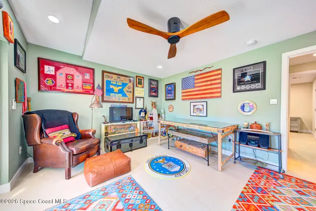 a view of a house with swimming pool and sitting area