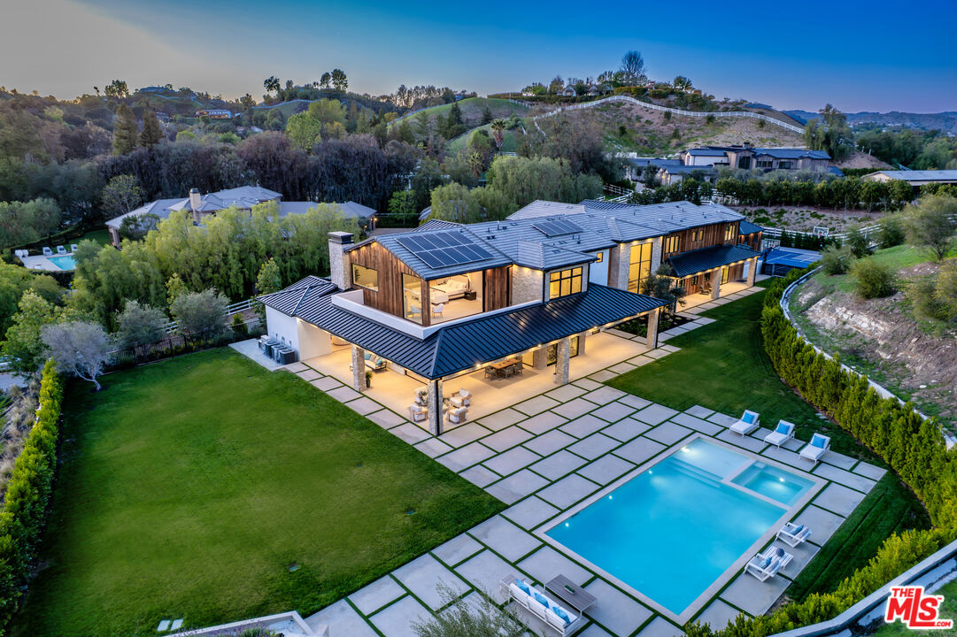 an aerial view of a house with a garden