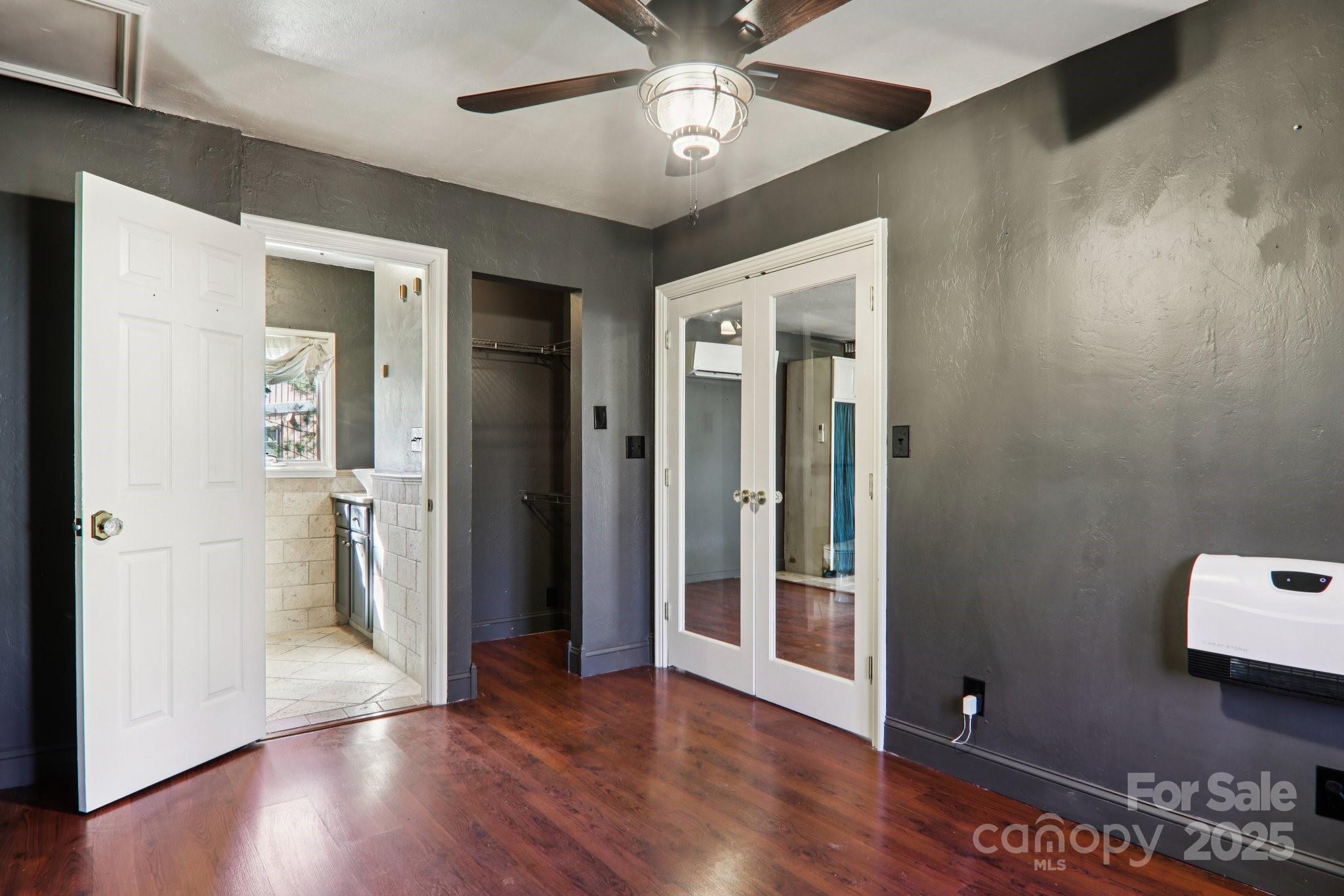 1749 Haywood Road Hendersonville, NC 28791 - Photo 19 of 48 an empty room with wooden floor closet and windows