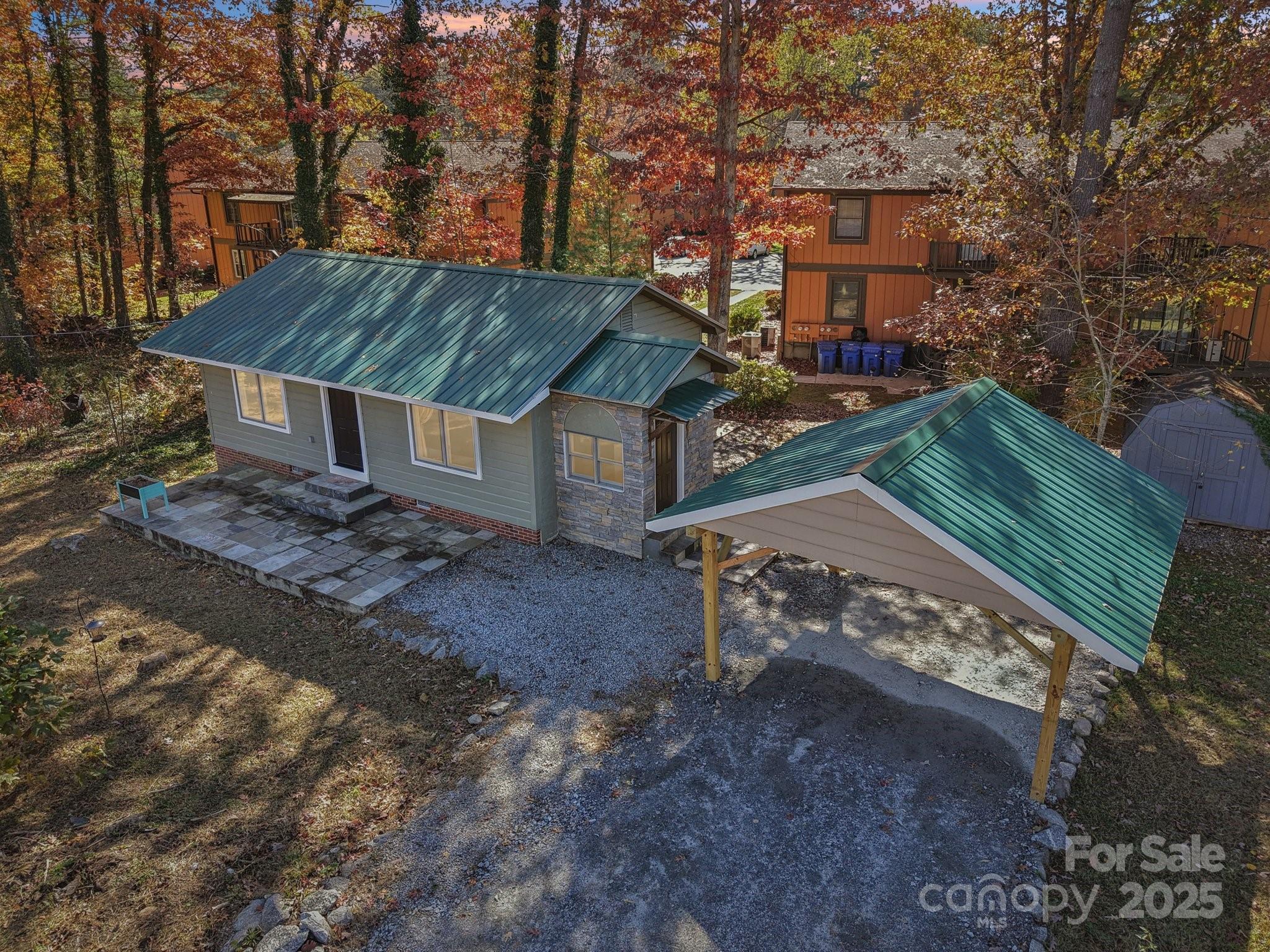 1749 Haywood Road Hendersonville, NC 28791 - Photo 27 of 48 a view of a house with a yard