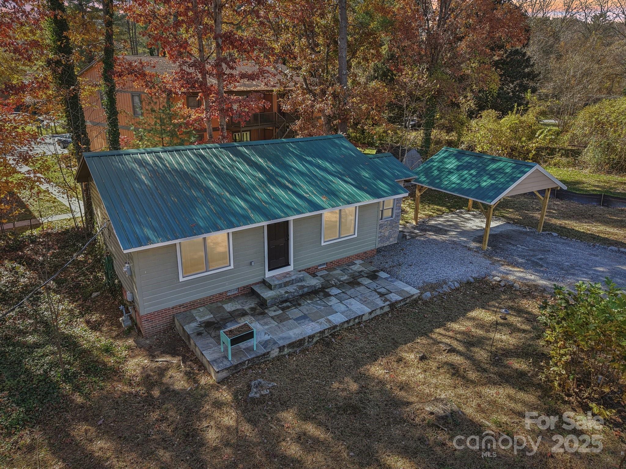 1749 Haywood Road Hendersonville, NC 28791 - Photo 28 of 48 a view of a backyard with trees
