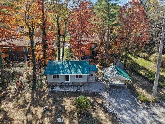 a wooden bench sitting in the middle of a forest