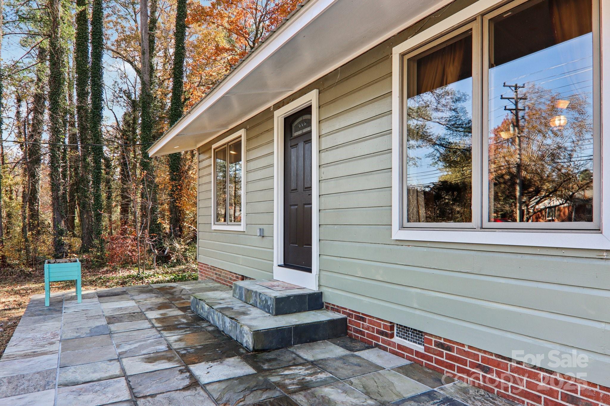 1749 Haywood Road Hendersonville, NC 28791 - Photo 30 of 48 a front view of a house with a chair