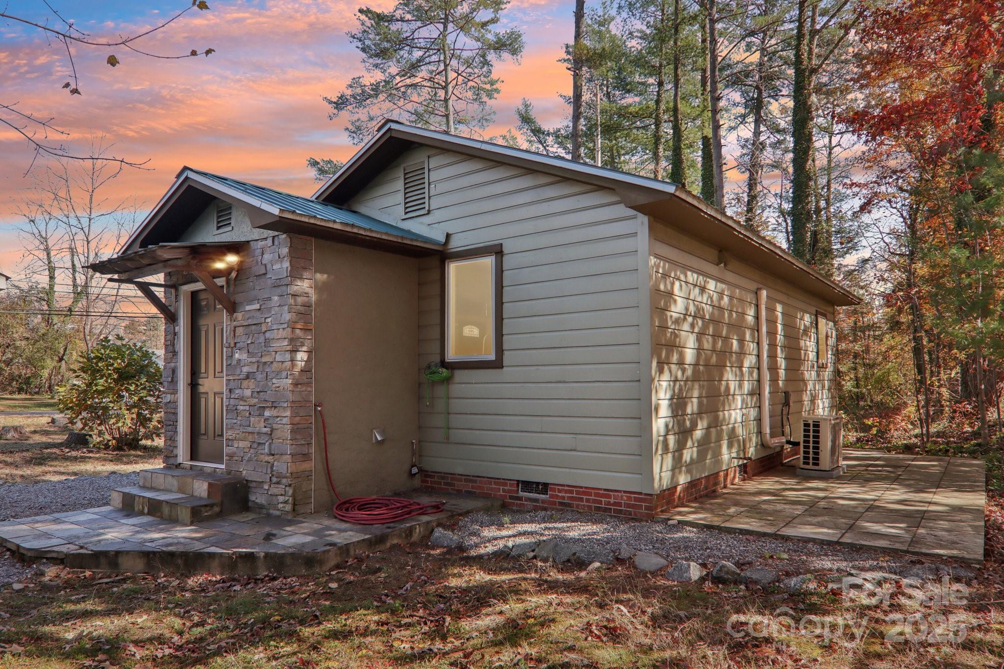 1749 Haywood Road Hendersonville, NC 28791 - Photo 31 of 48 a front view of a house with a yard