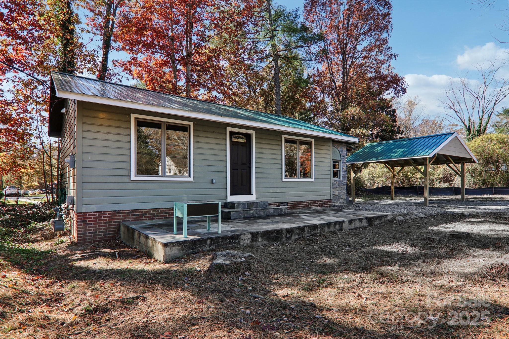 1749 Haywood Road Hendersonville, NC 28791 - Photo 40 of 48 a view of a house with backyard and sitting area