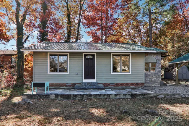 a front view of a house with garden