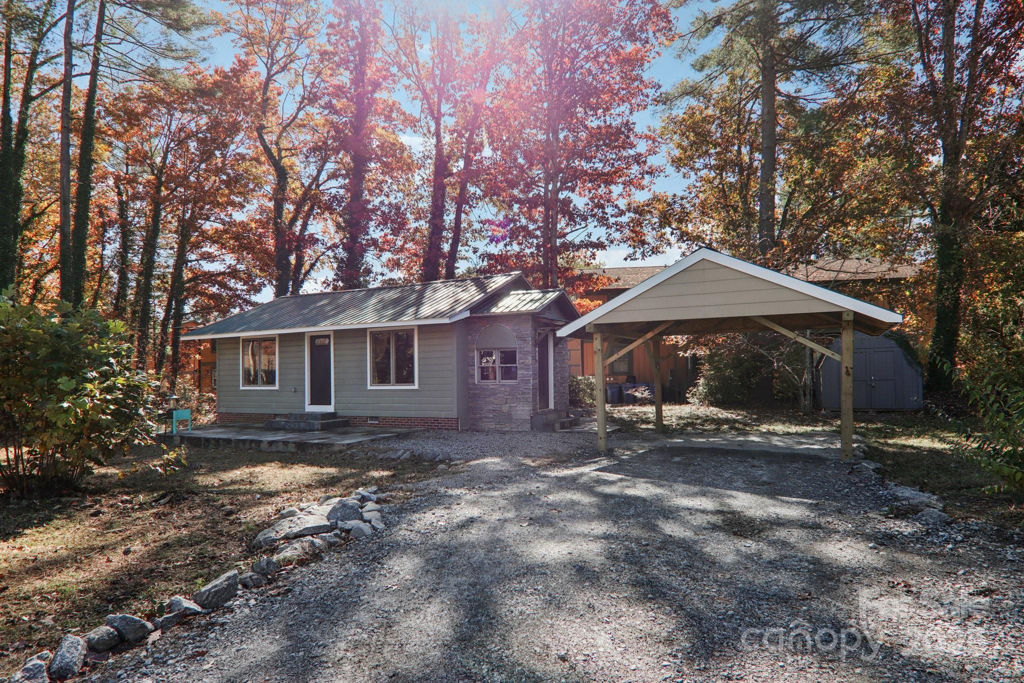 1749 Haywood Road Hendersonville, NC 28791 - Photo 42 of 48 a view of a house with a yard