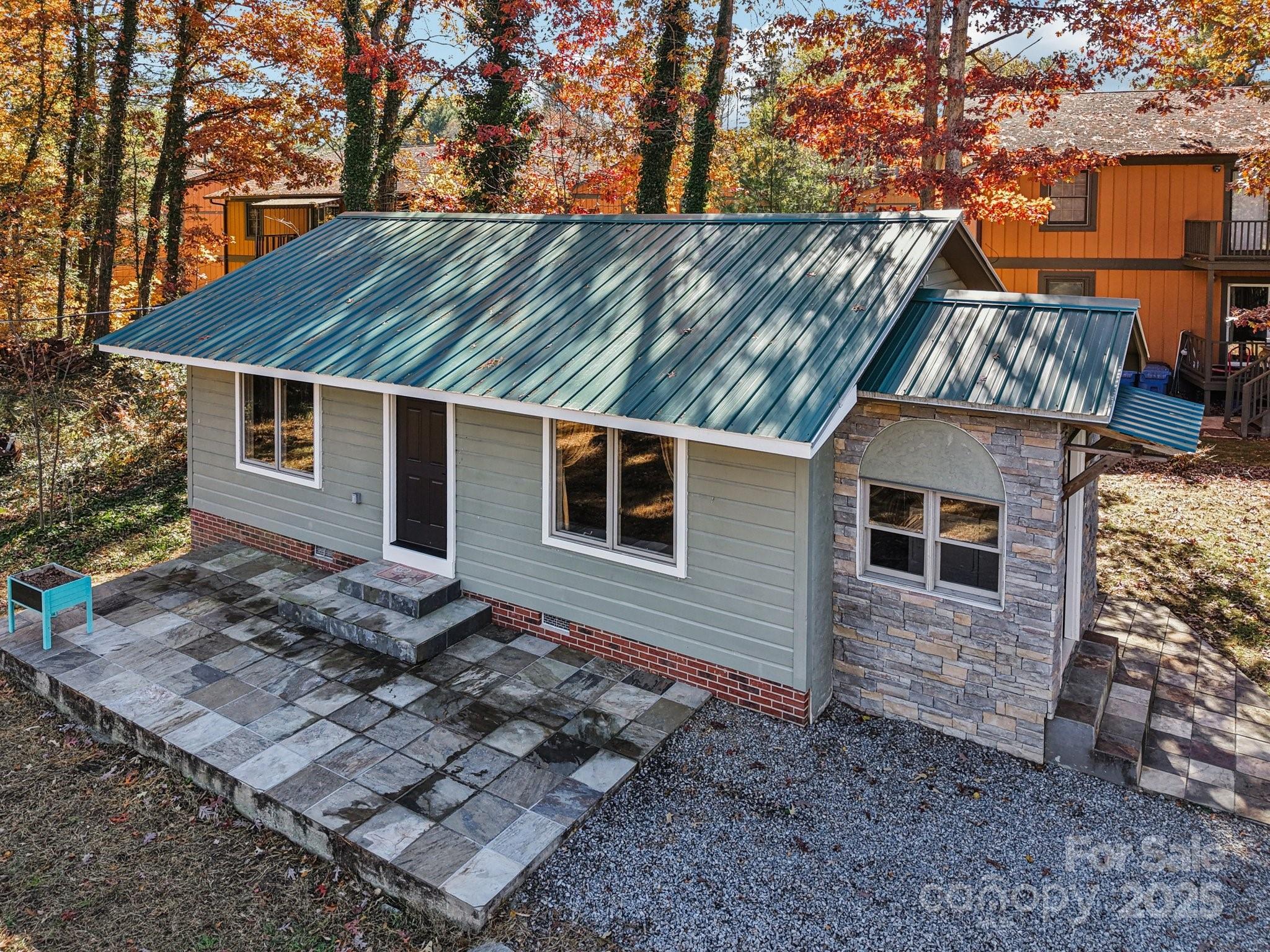 1749 Haywood Road Hendersonville, NC 28791 - Photo 43 of 48 a view of a house with a yard