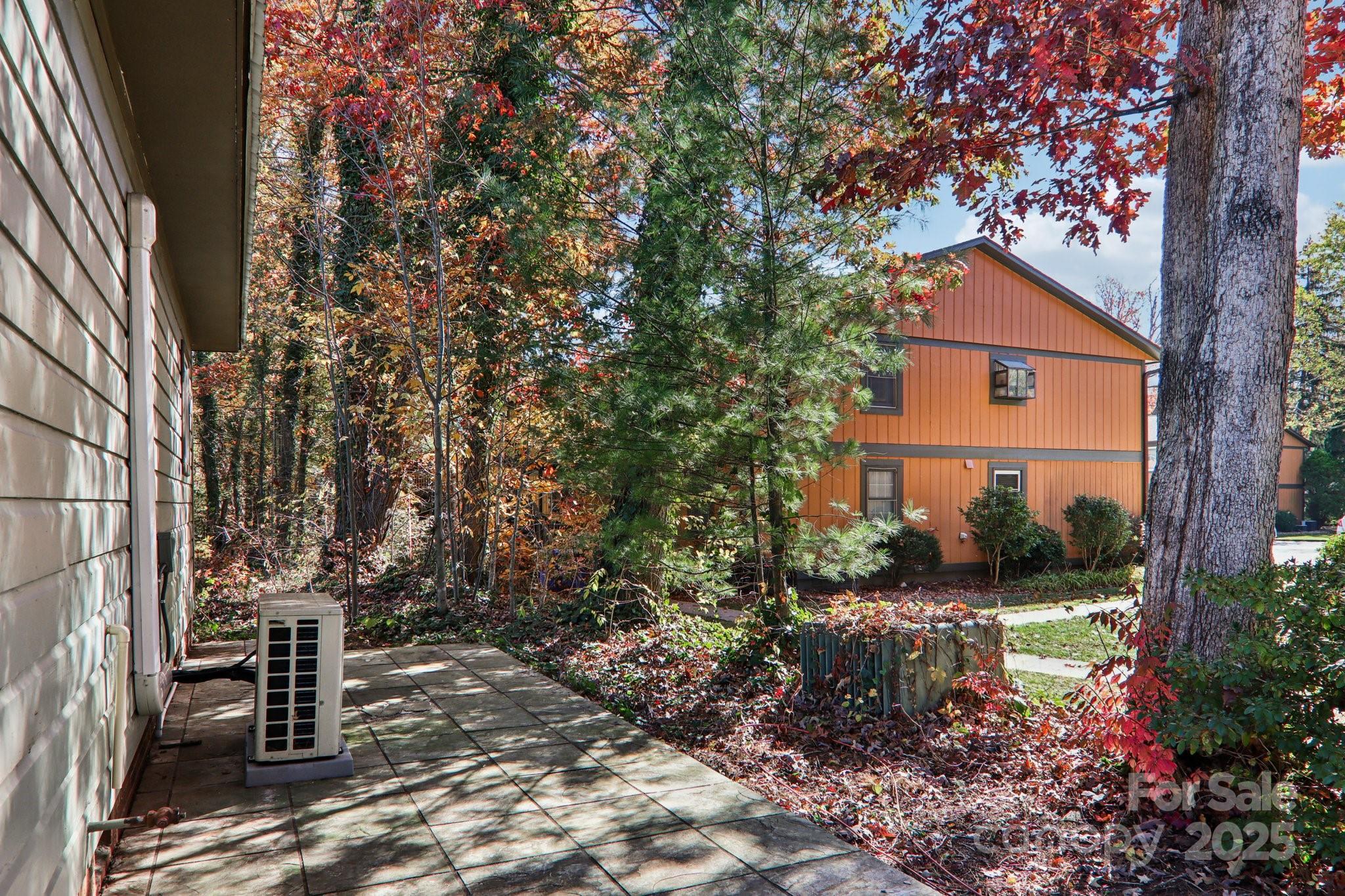 1749 Haywood Road Hendersonville, NC 28791 - Photo 47 of 48 a view of house with yard and sitting area