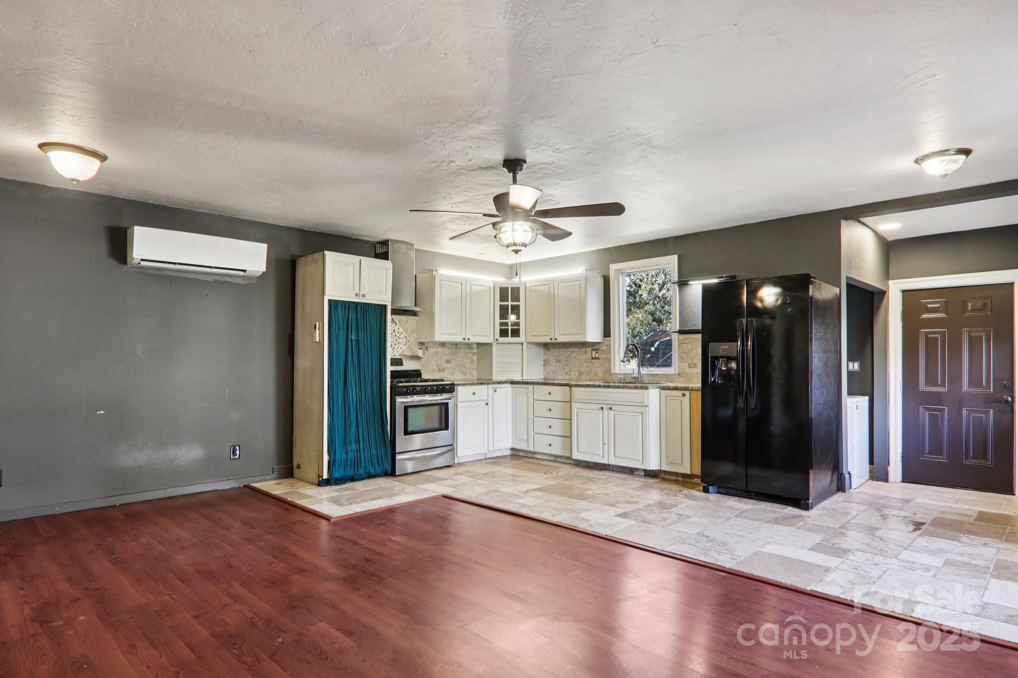 1749 Haywood Road Hendersonville, NC 28791 - Photo 6 of 48 a view of a kitchen with refrigerator and a sink