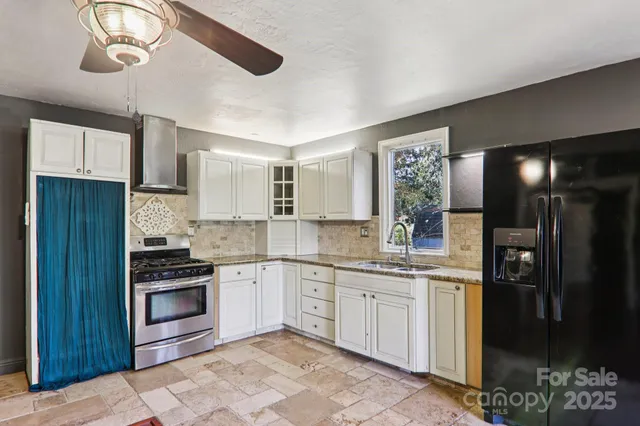 a kitchen with a sink stainless steel appliances and cabinets