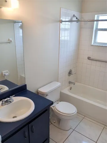 a bathroom with a shower a toilet and a shower