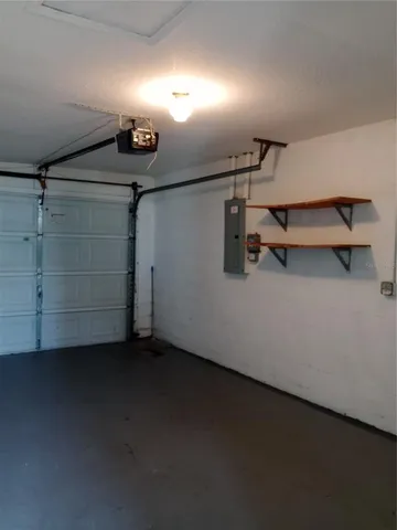 a view of a garden with a building in the background