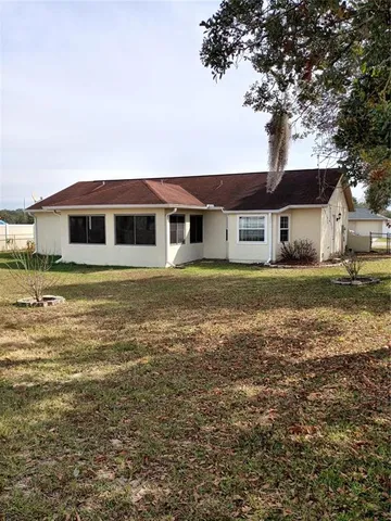 a view of a backyard of the house
