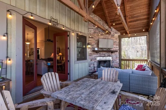a outdoor living space with furniture and a fireplace