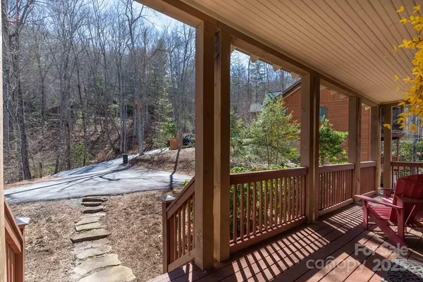 a view of a patio with a table chairs and backyard