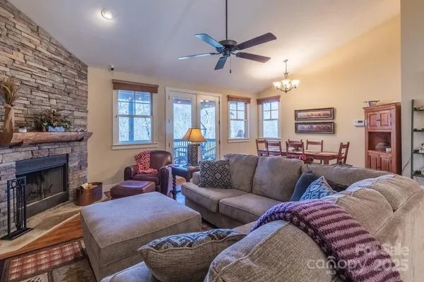 a living room with lots of furniture and a fireplace