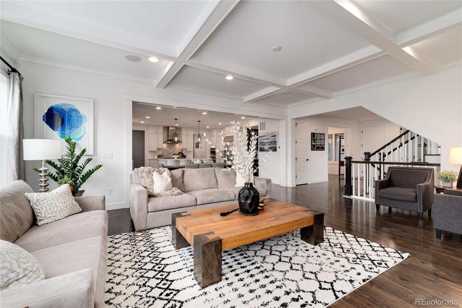 10841 Greycliffe Drive Highlands Ranch, CO 80126 - Photo 8 of 25 a living room with furniture rug and wooden floor
