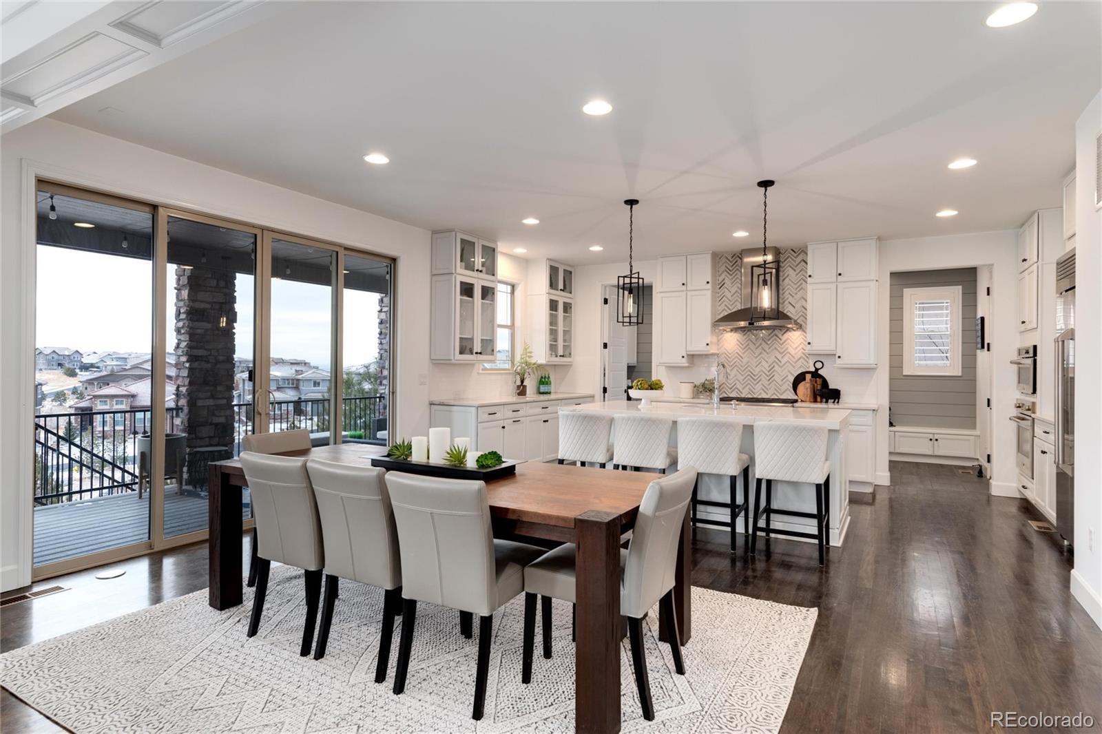 10841 Greycliffe Drive Highlands Ranch, CO 80126 - Photo 9 of 25 a view of a dining room with furniture and wooden floor