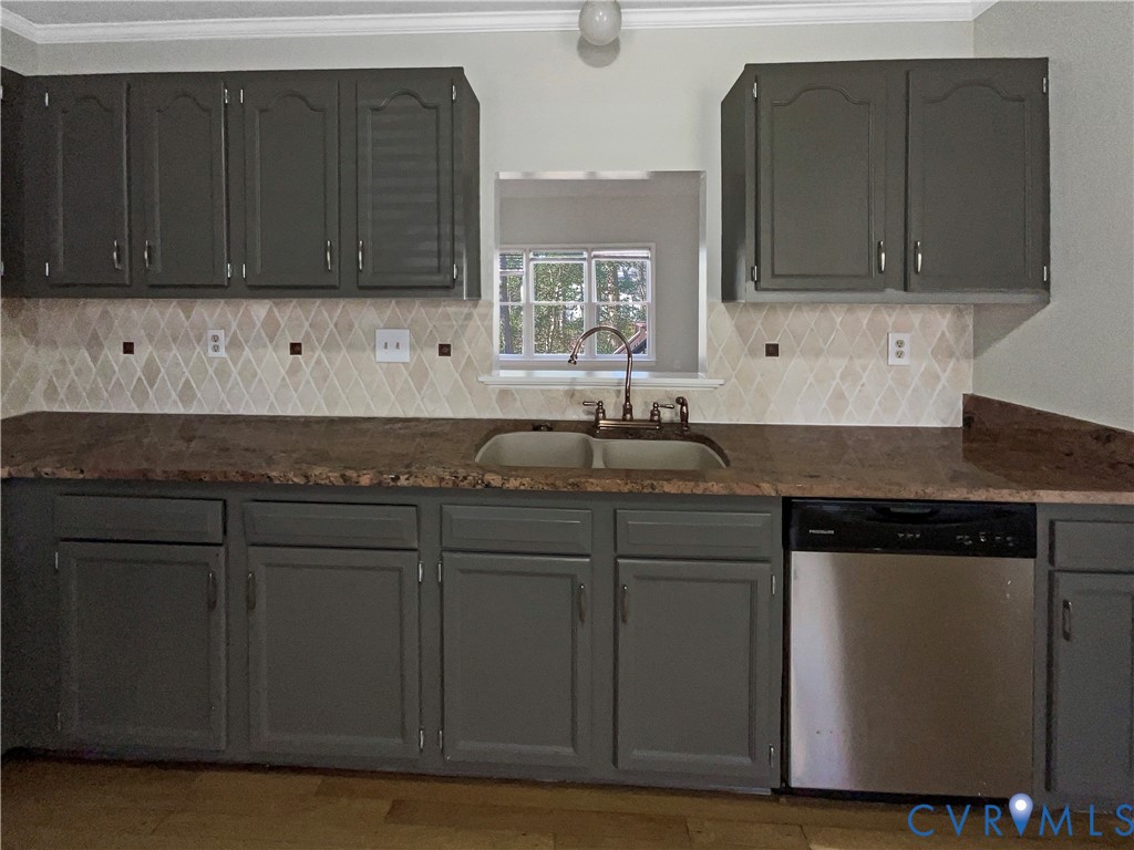 5614 Chatmoss Road Midlothian, VA 23112 - Photo 11 of 25 a kitchen with stainless steel appliances granite countertop a stove a sink and a microwave