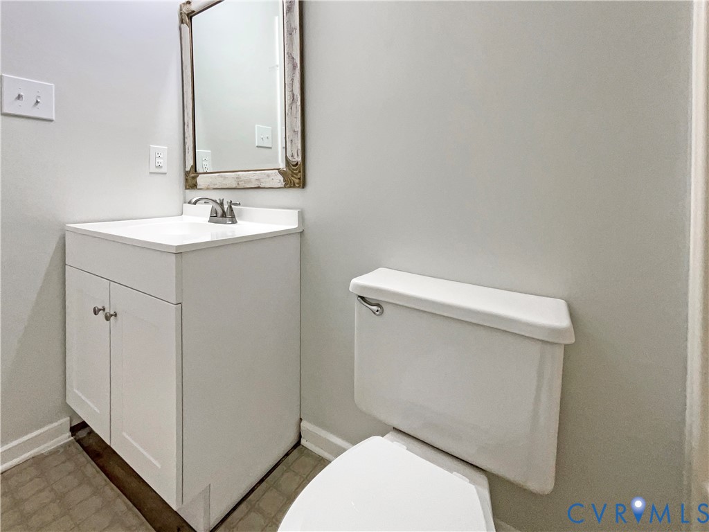 5614 Chatmoss Road Midlothian, VA 23112 - Photo 13 of 25 a bathroom with a sink mirror vanity and toilet