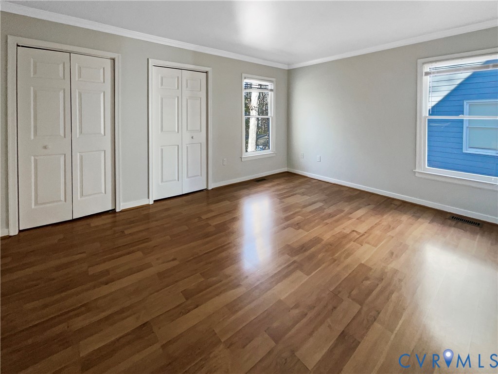 5614 Chatmoss Road Midlothian, VA 23112 - Photo 16 of 25 a view of an empty room with wooden floor and a window