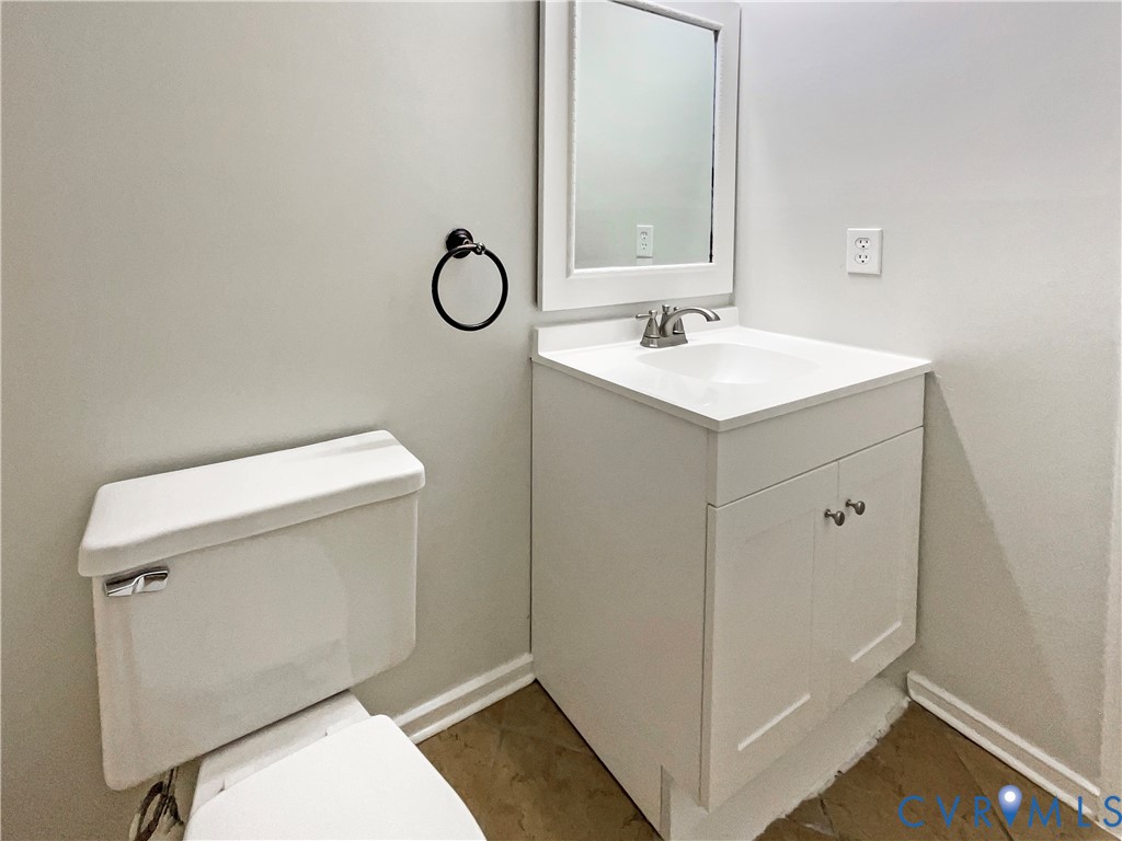 5614 Chatmoss Road Midlothian, VA 23112 - Photo 18 of 25 a bathroom with a sink mirror vanity and toilet
