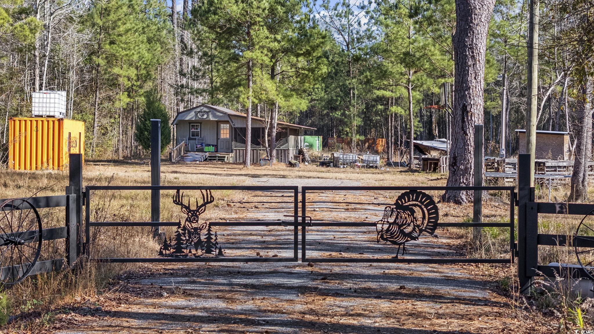 705 Catclaw Road Andrews, SC 29510 - Photo 6 of 26 View of gate