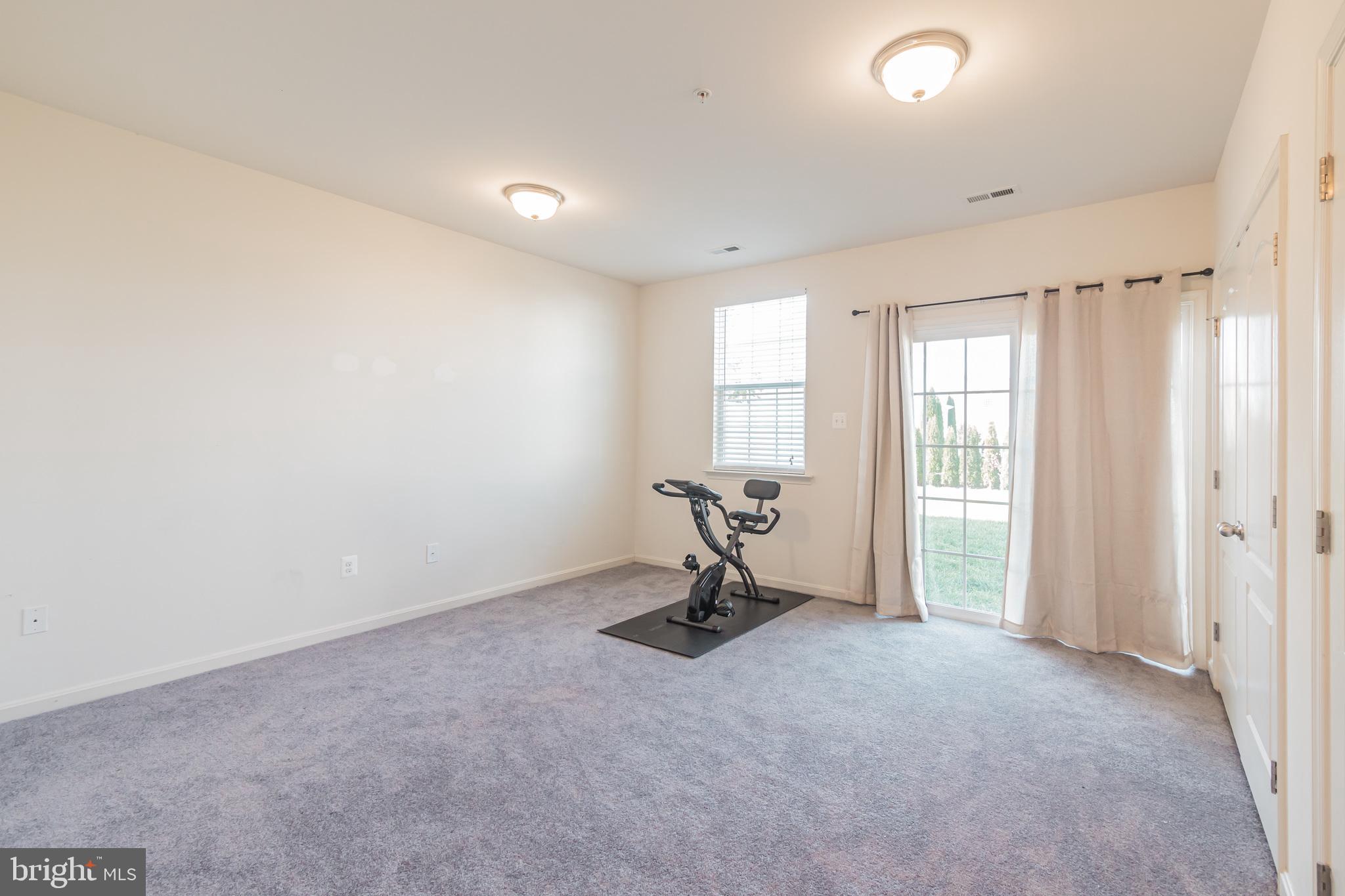 Rec room with sliding door to the backyard