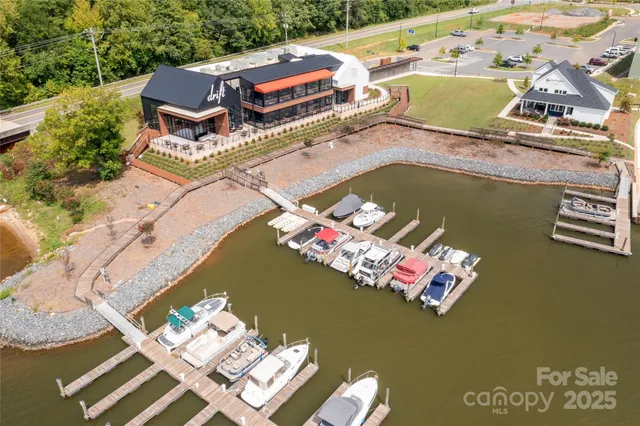 an aerial view of a house with a ocean view