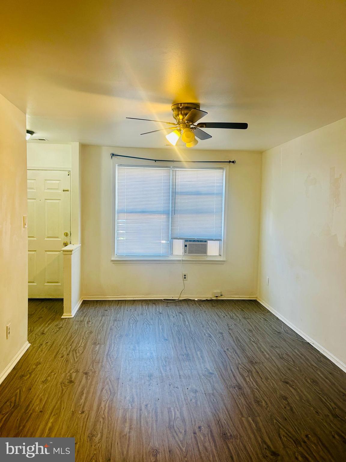 9455 Fairgreen Lane Philadelphia, PA 19114 - Photo 2 of 10 a view of an empty room with a window and wooden floor